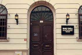 Historic entrance of Bahçeşehir University with architectural details and signage.